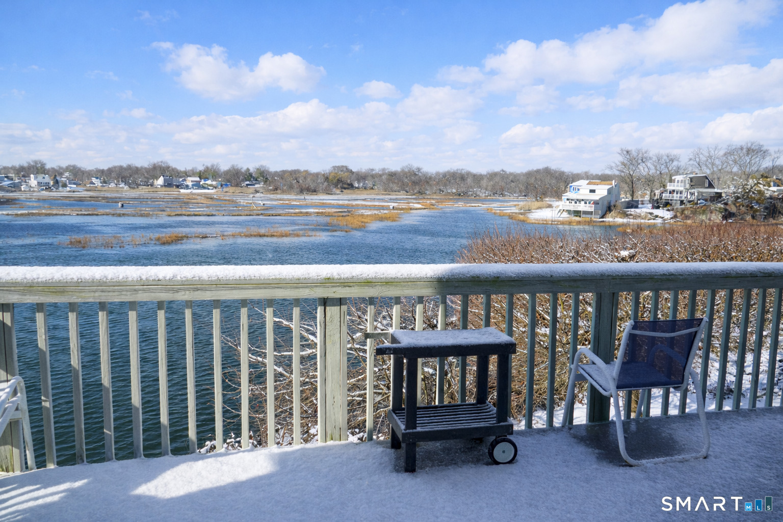 2 Mansfield Grove Road, Unit 170 East Haven, CT 06512 - Photo 24 of 27 a view of a balcony with wooden chairs and city view