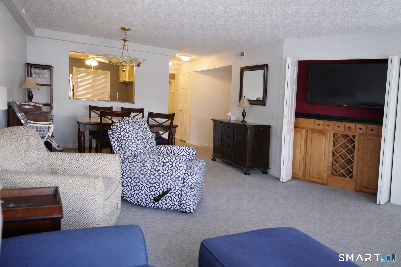 2 Mansfield Grove Road, Unit 170 East Haven, CT 06512 - Photo 7 of 27 a living room with furniture and a flat screen tv