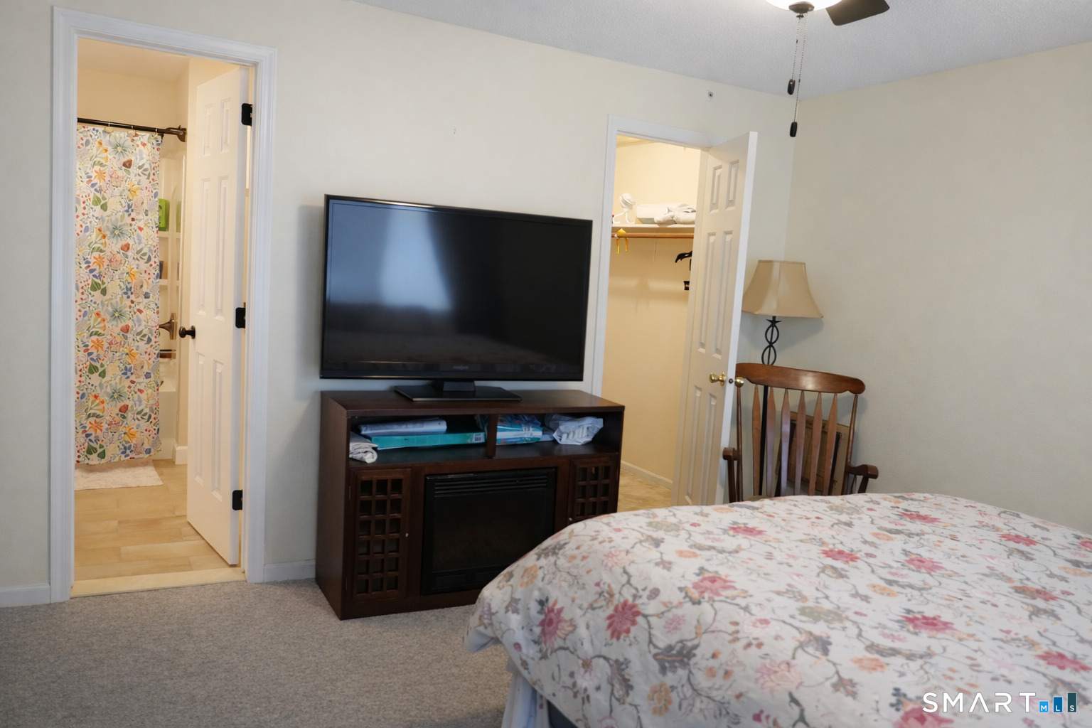 2 Mansfield Grove Road, Unit 170 East Haven, CT 06512 - Photo 10 of 27 a bedroom with a bed and a flat screen tv
