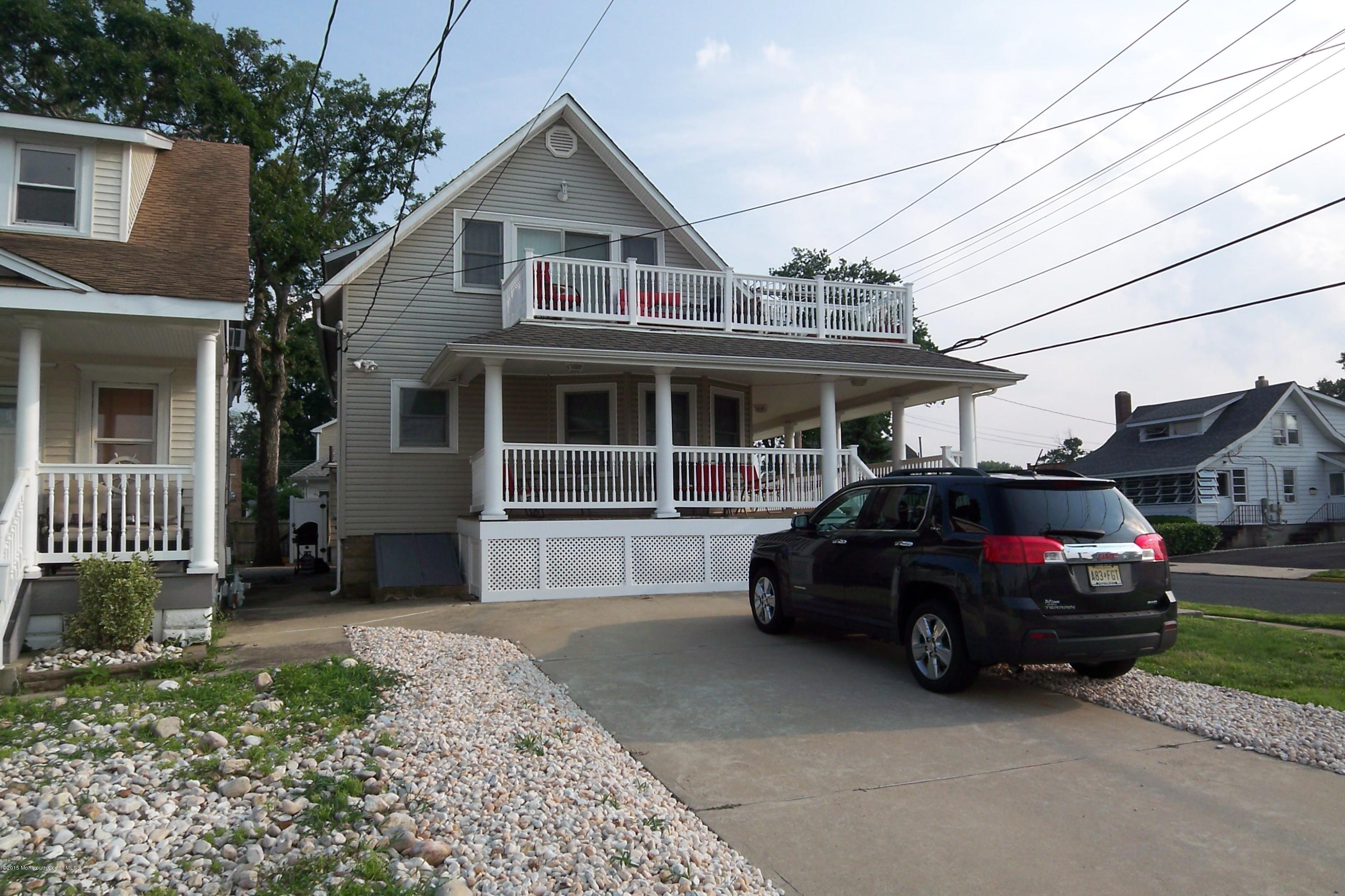 1219 River Road Belmar, NJ 07719 - Photo 2 of 14 a view of a car parked in front of house