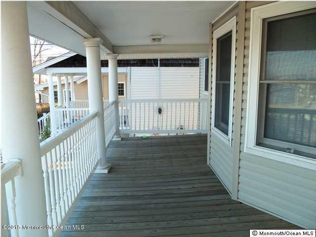 1219 River Road Belmar, NJ 07719 - Photo 5 of 14 a view of a house with wooden floor