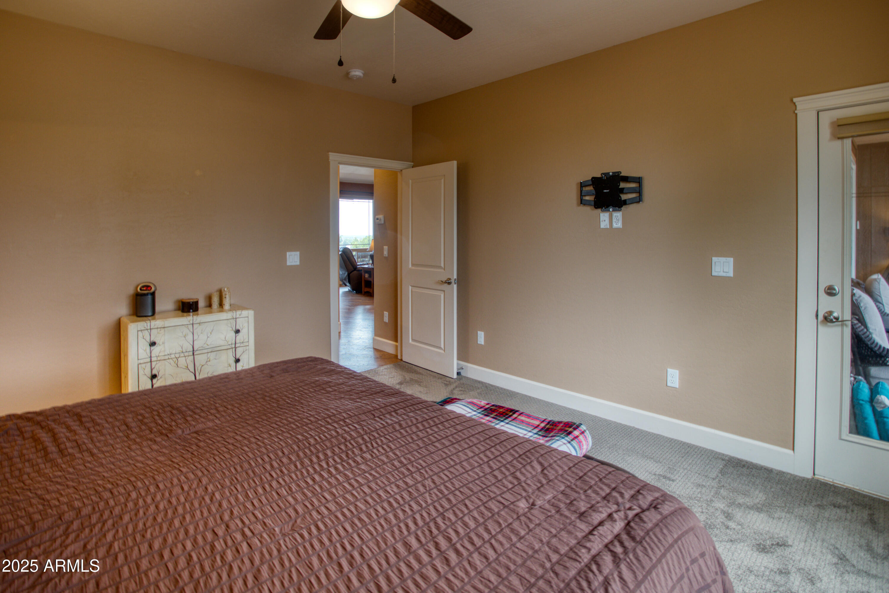 901 South Ridgeline Drive Show Low, AZ 85901 - Photo 11 of 31 a bedroom with a bed and a chandelier