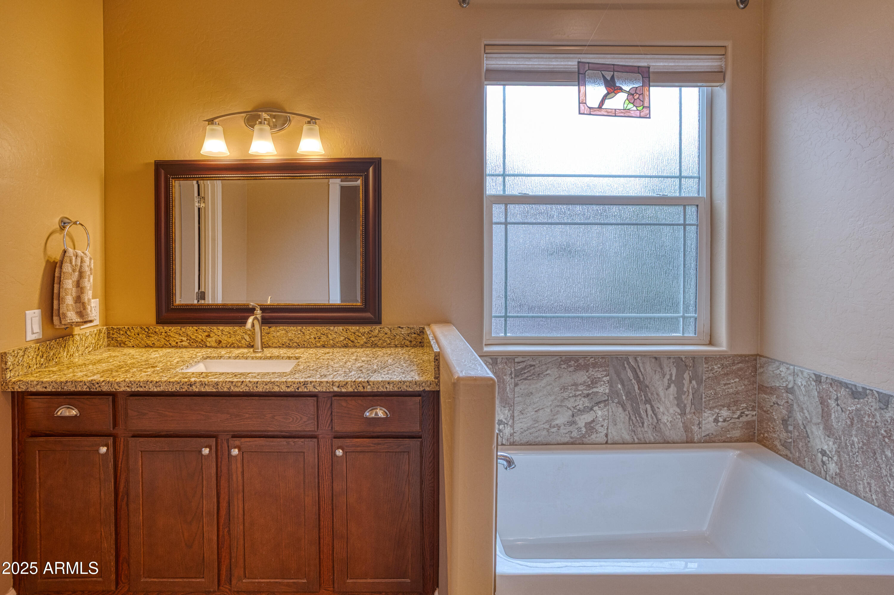 901 South Ridgeline Drive Show Low, AZ 85901 - Photo 15 of 31 a bathroom with a granite countertop sink and a mirror