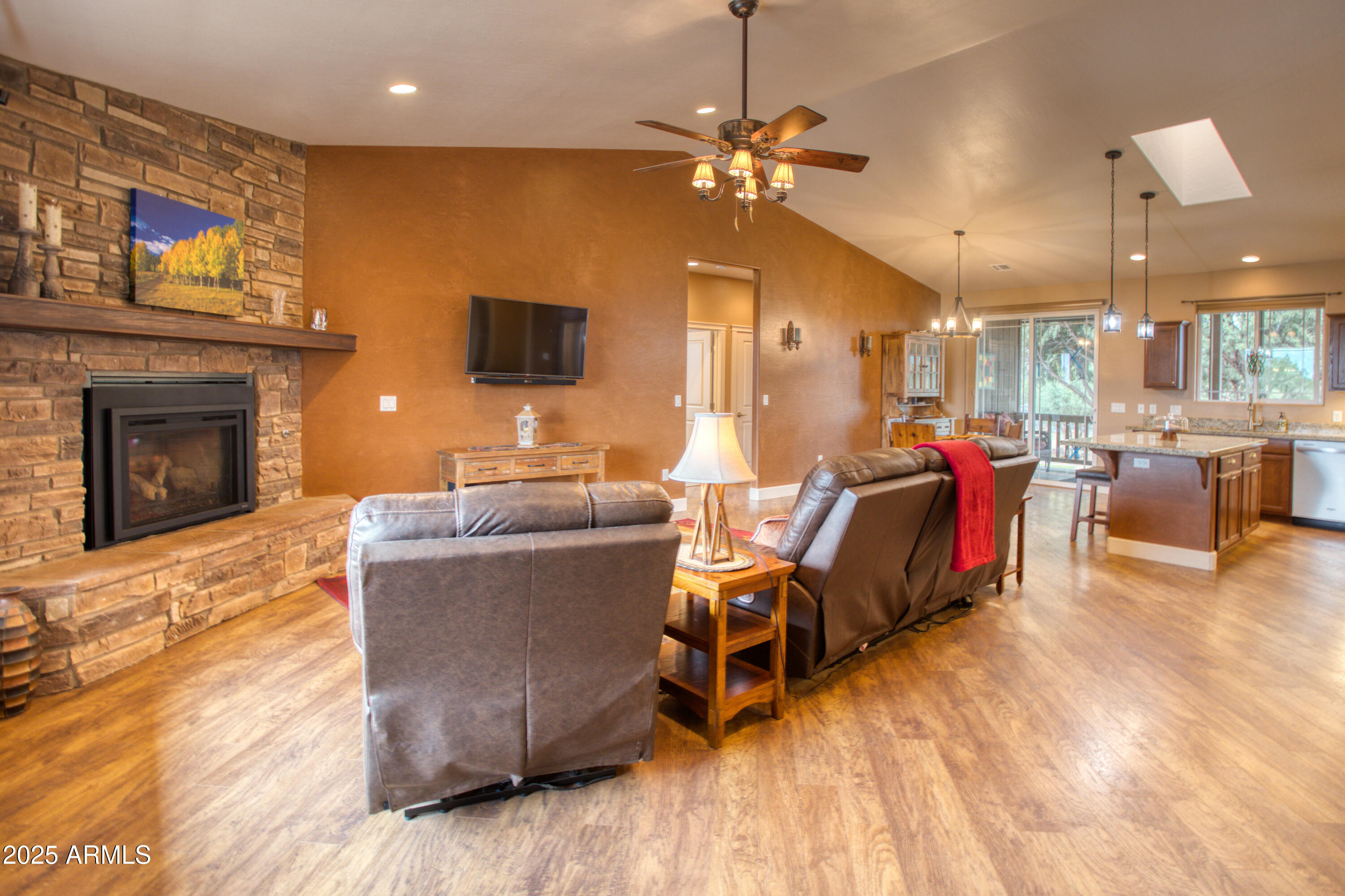901 South Ridgeline Drive Show Low, AZ 85901 - Photo 6 of 31 a living room with furniture and a fireplace