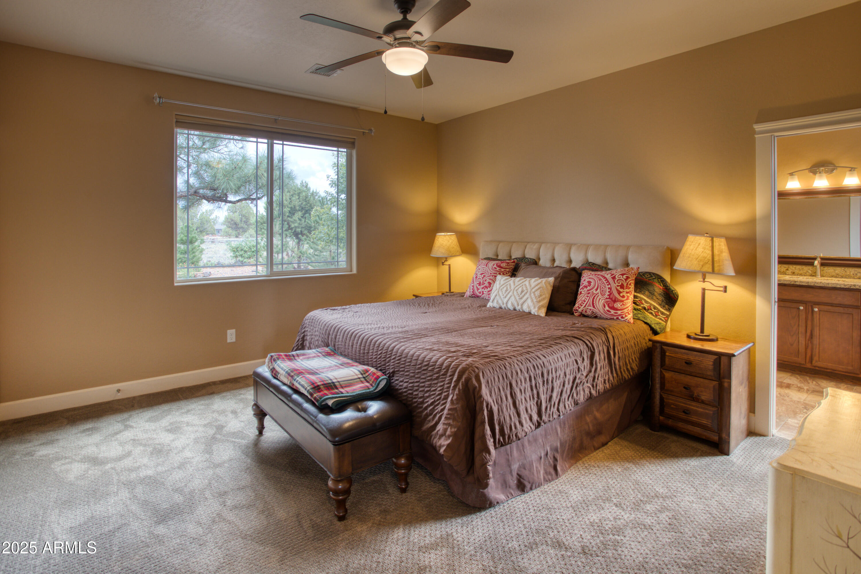 901 South Ridgeline Drive Show Low, AZ 85901 - Photo 10 of 31 a bedroom with a bed and a chandelier