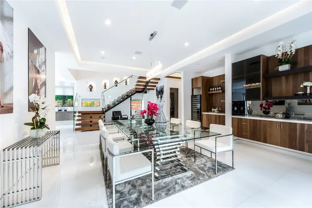 a living room with lots of furniture and a dining table
