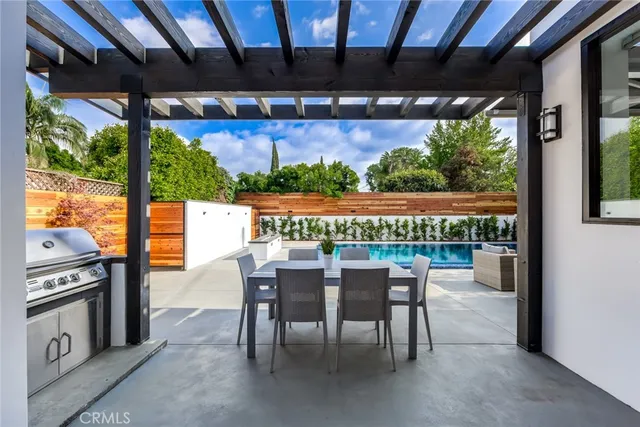 a view of an outdoor dining space with furniture