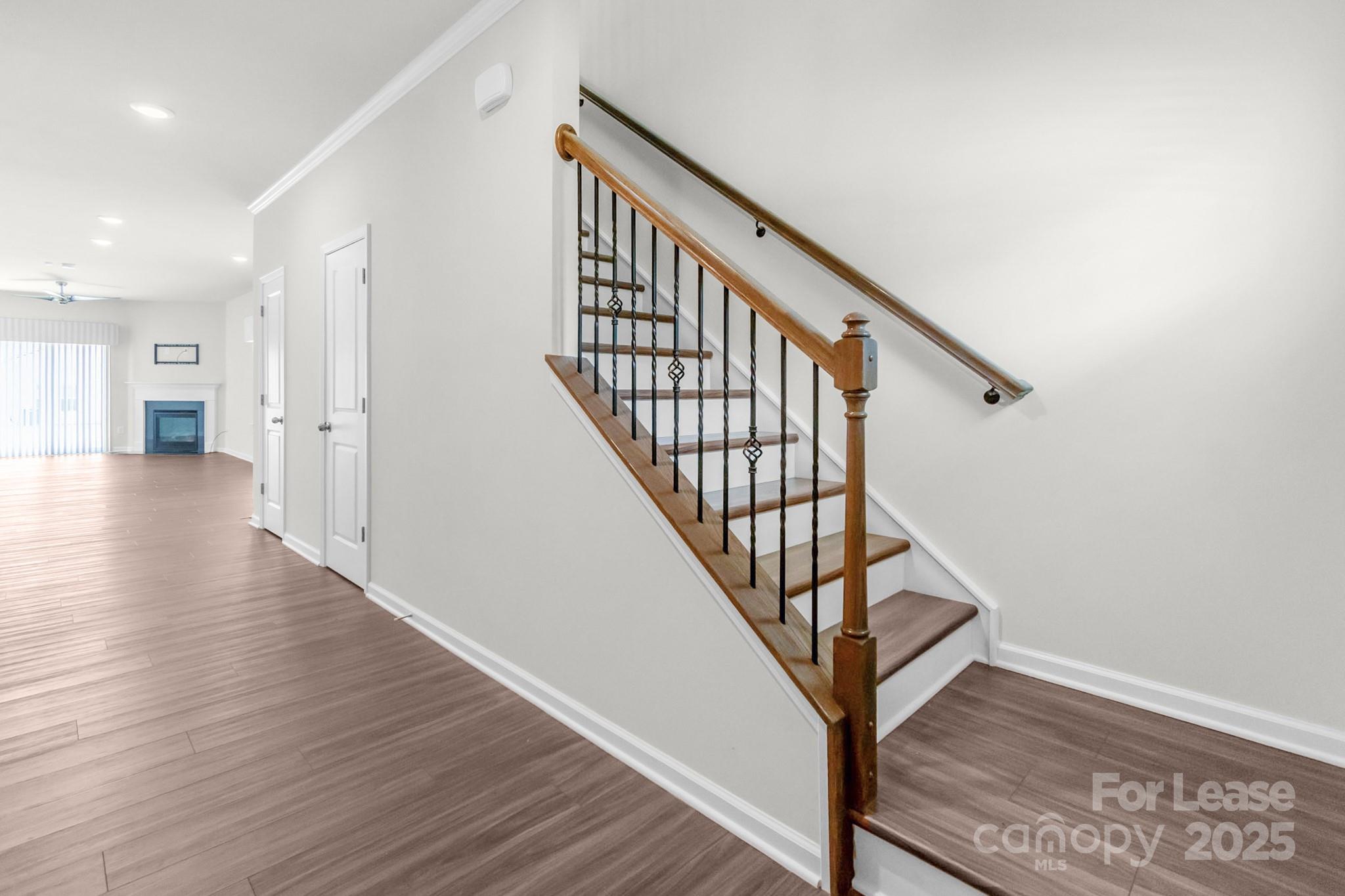 15520 Capps Road Charlotte, NC 28278 - Photo 21 of 48 a view of a hallway with wooden floor and stairs