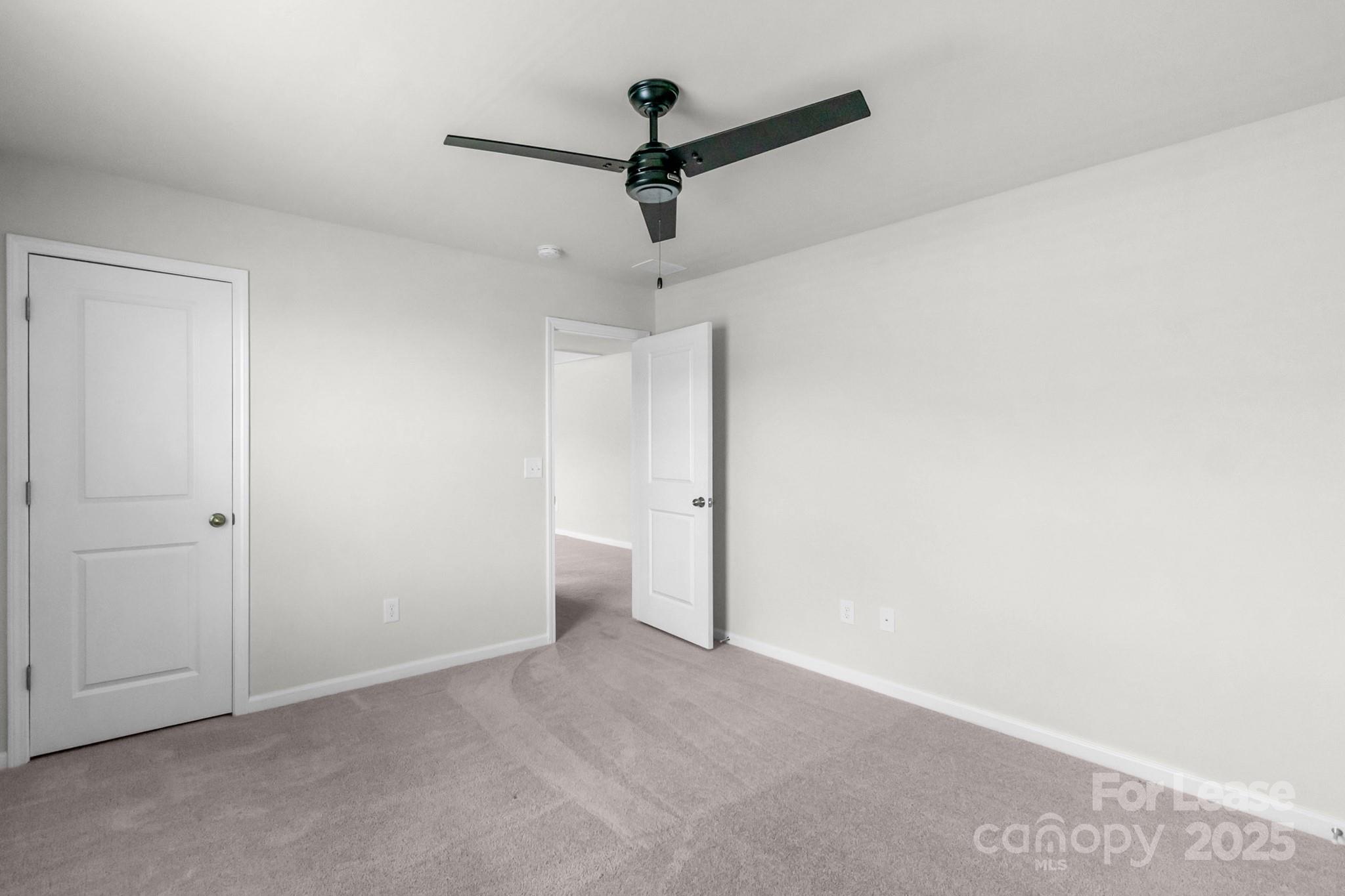 15520 Capps Road Charlotte, NC 28278 - Photo 27 of 48 a view of a livingroom with a ceiling fan and wooden floor