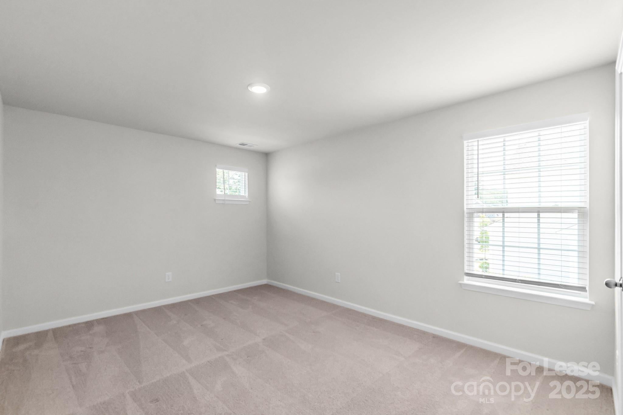 15520 Capps Road Charlotte, NC 28278 - Photo 32 of 48 an empty room with windows