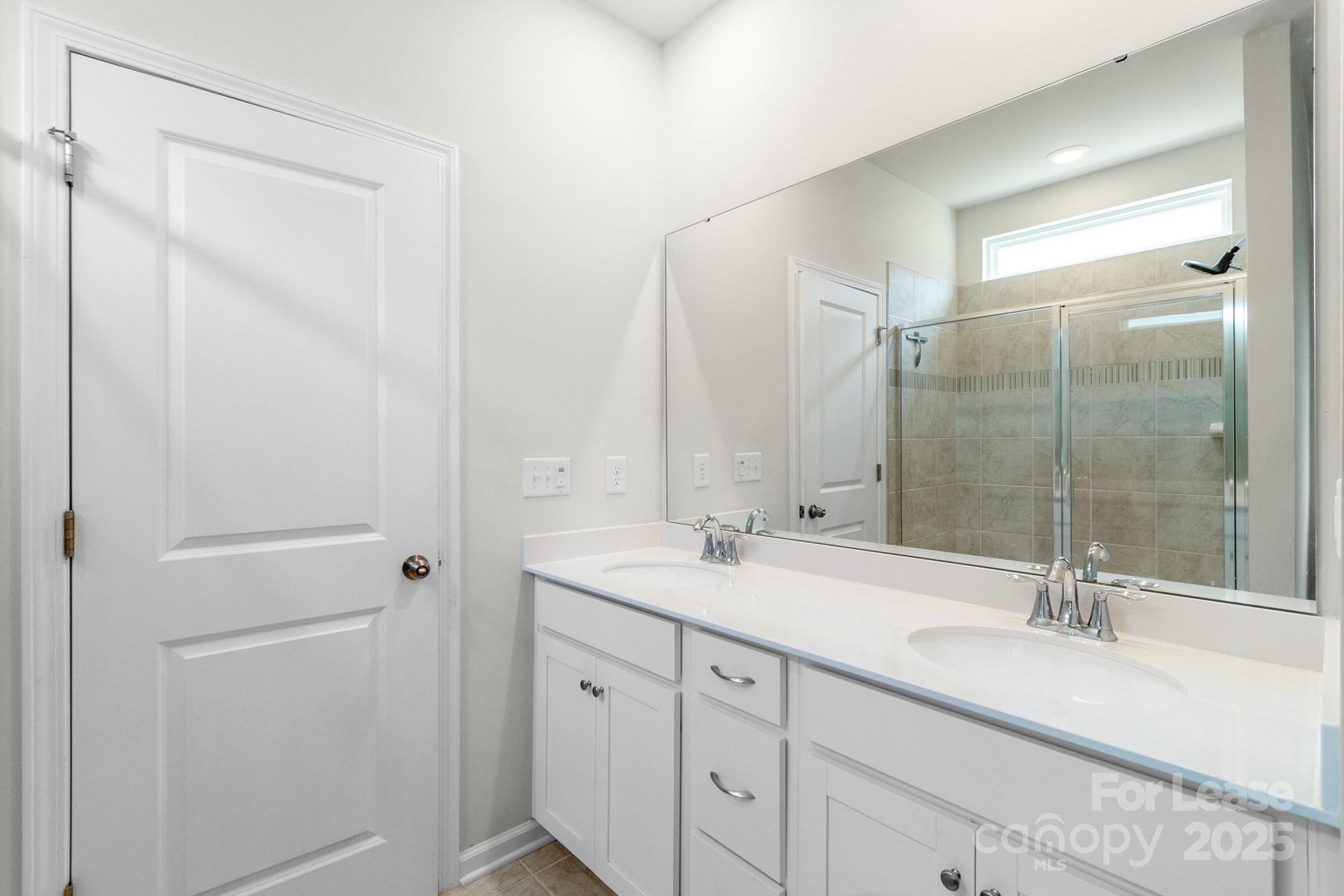 15520 Capps Road Charlotte, NC 28278 - Photo 33 of 48 a bathroom with a double vanity sink mirror and double