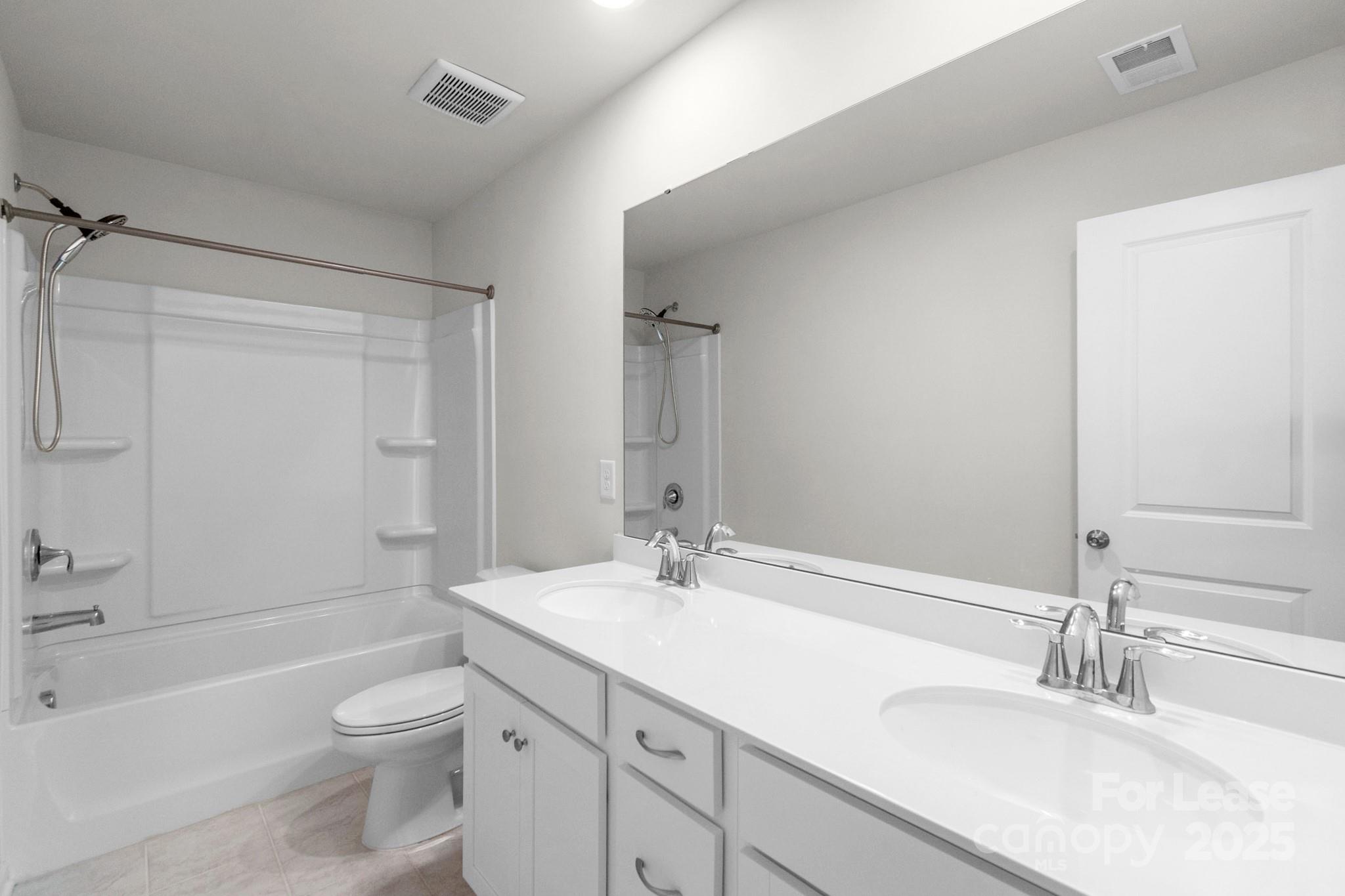 15520 Capps Road Charlotte, NC 28278 - Photo 34 of 48 a bathroom with a sink a toilet and shower