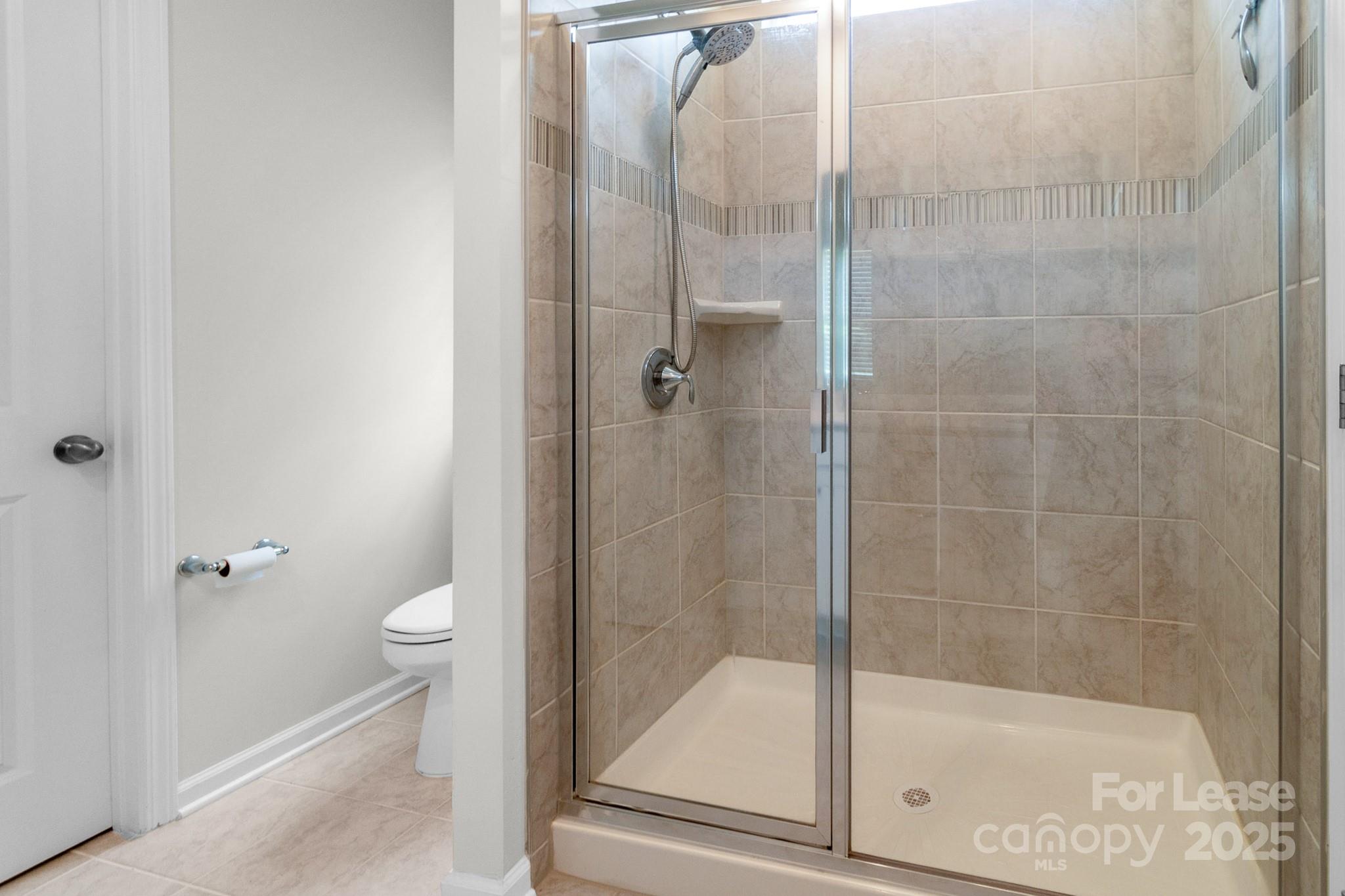 15520 Capps Road Charlotte, NC 28278 - Photo 37 of 48 a bathroom with a shower and toilet