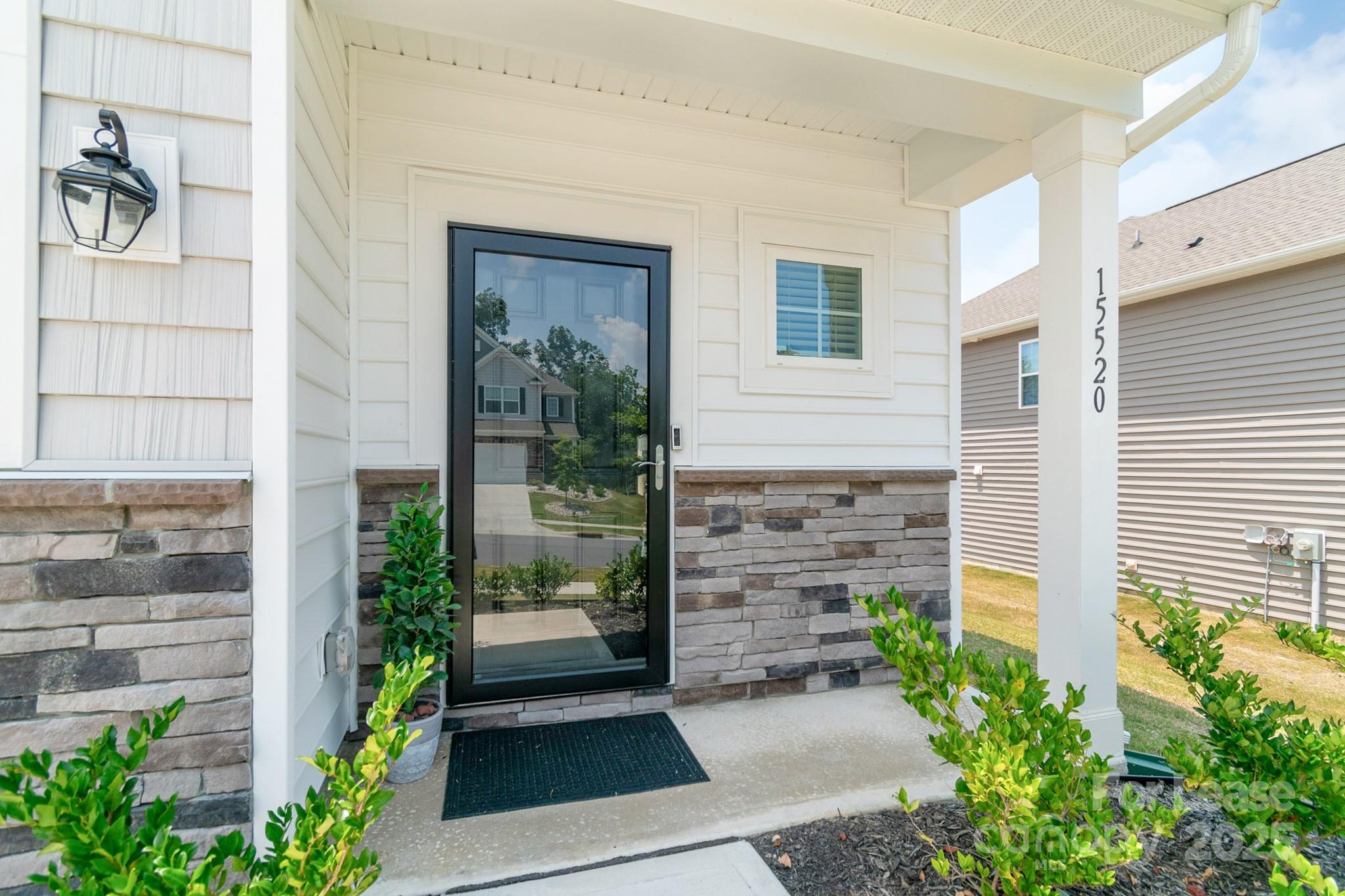 15520 Capps Road Charlotte, NC 28278 - Photo 42 of 48 a front view of a house with a garden