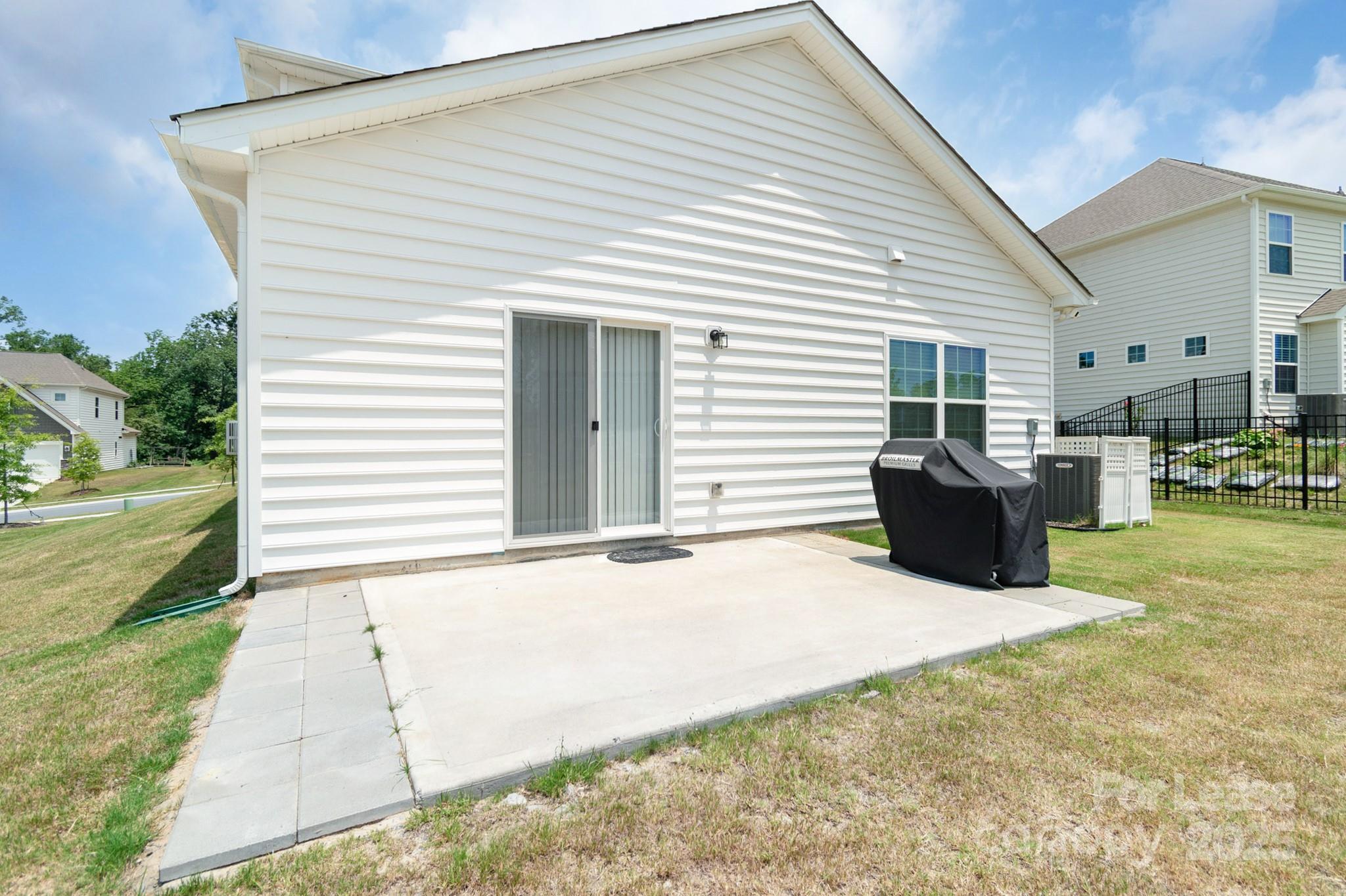 15520 Capps Road Charlotte, NC 28278 - Photo 45 of 48 a view of a house with backyard and a garden
