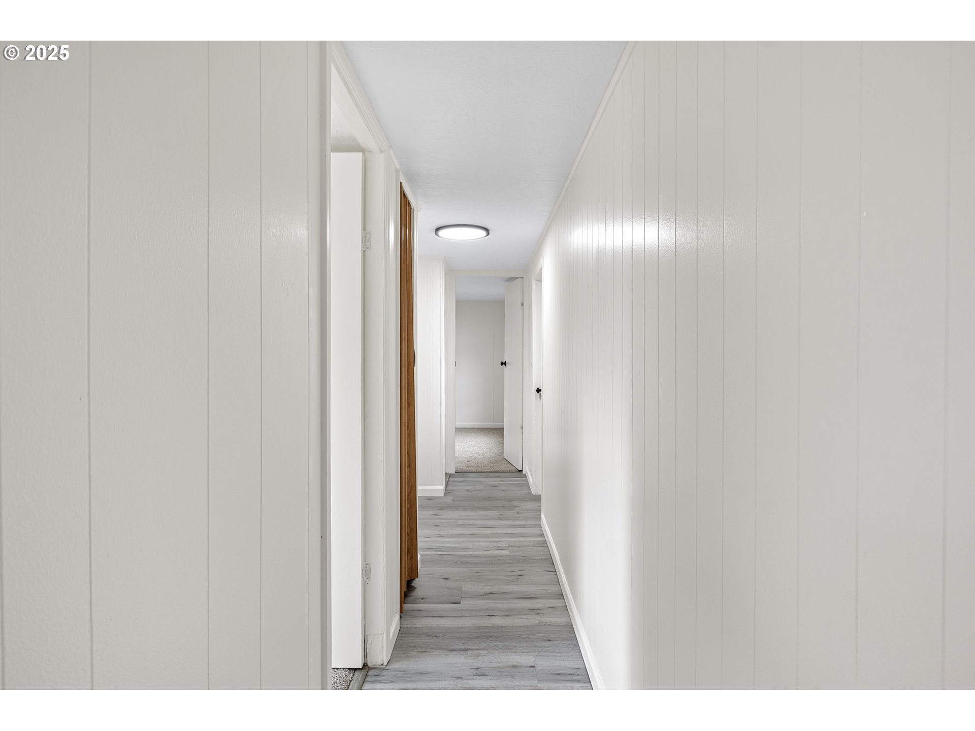 250 Northeast Jorgen Street Winston, OR 97496 - Photo 13 of 36 a view of a hallway with wooden floor
