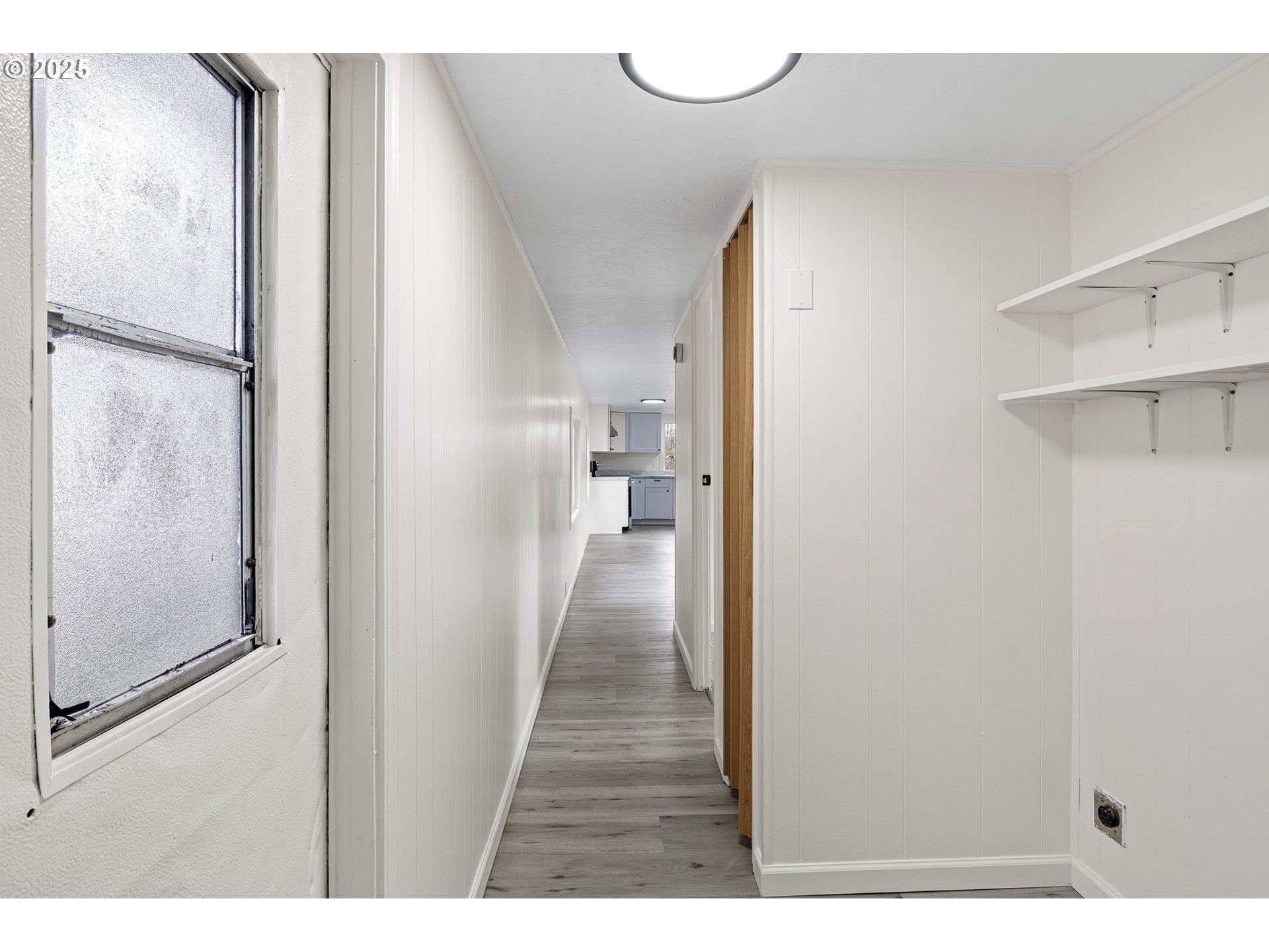 250 Northeast Jorgen Street Winston, OR 97496 - Photo 14 of 36 a view of a hallway with wooden floor and staircase