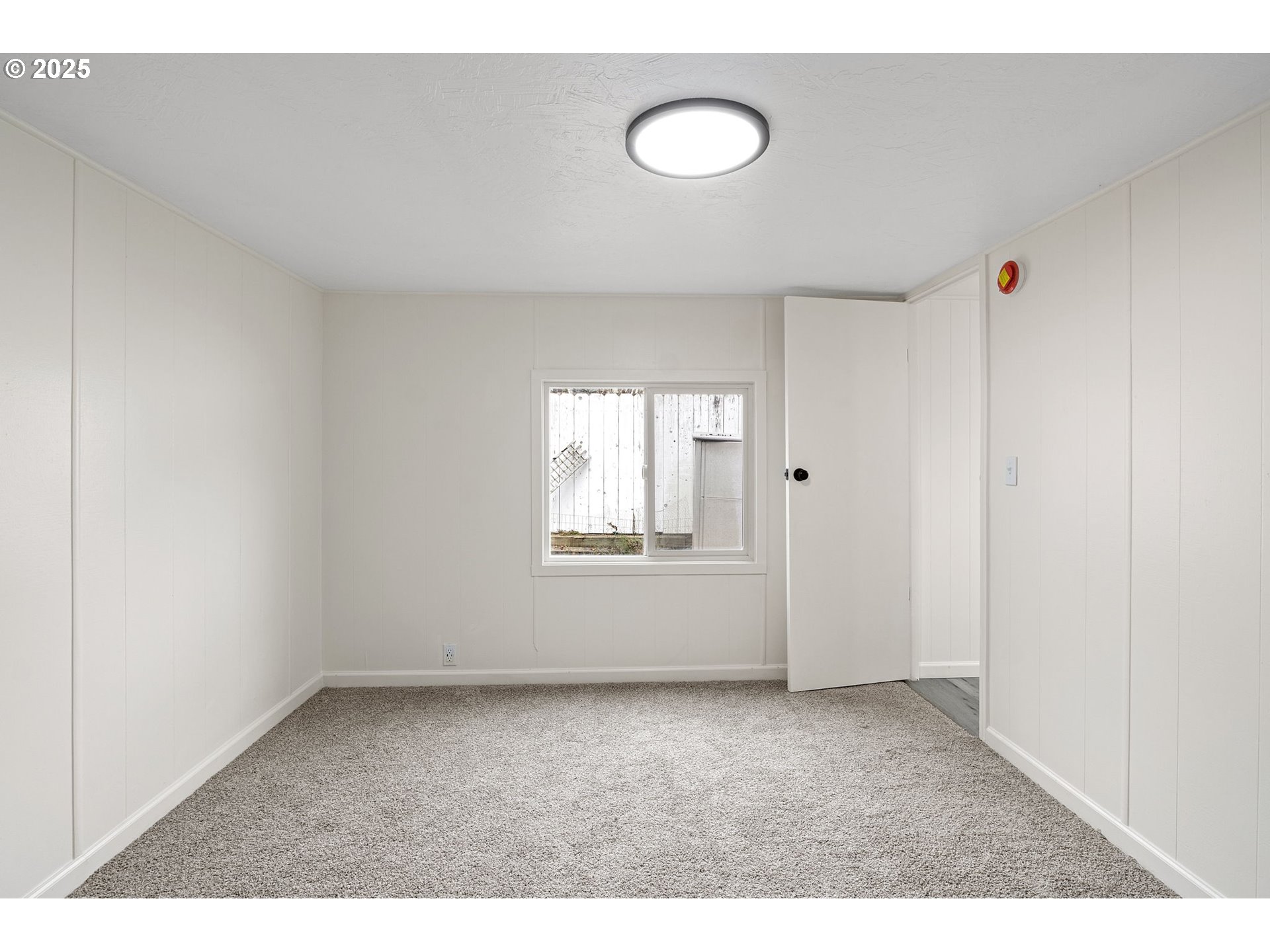 250 Northeast Jorgen Street Winston, OR 97496 - Photo 20 of 36 a view of an empty room with a window