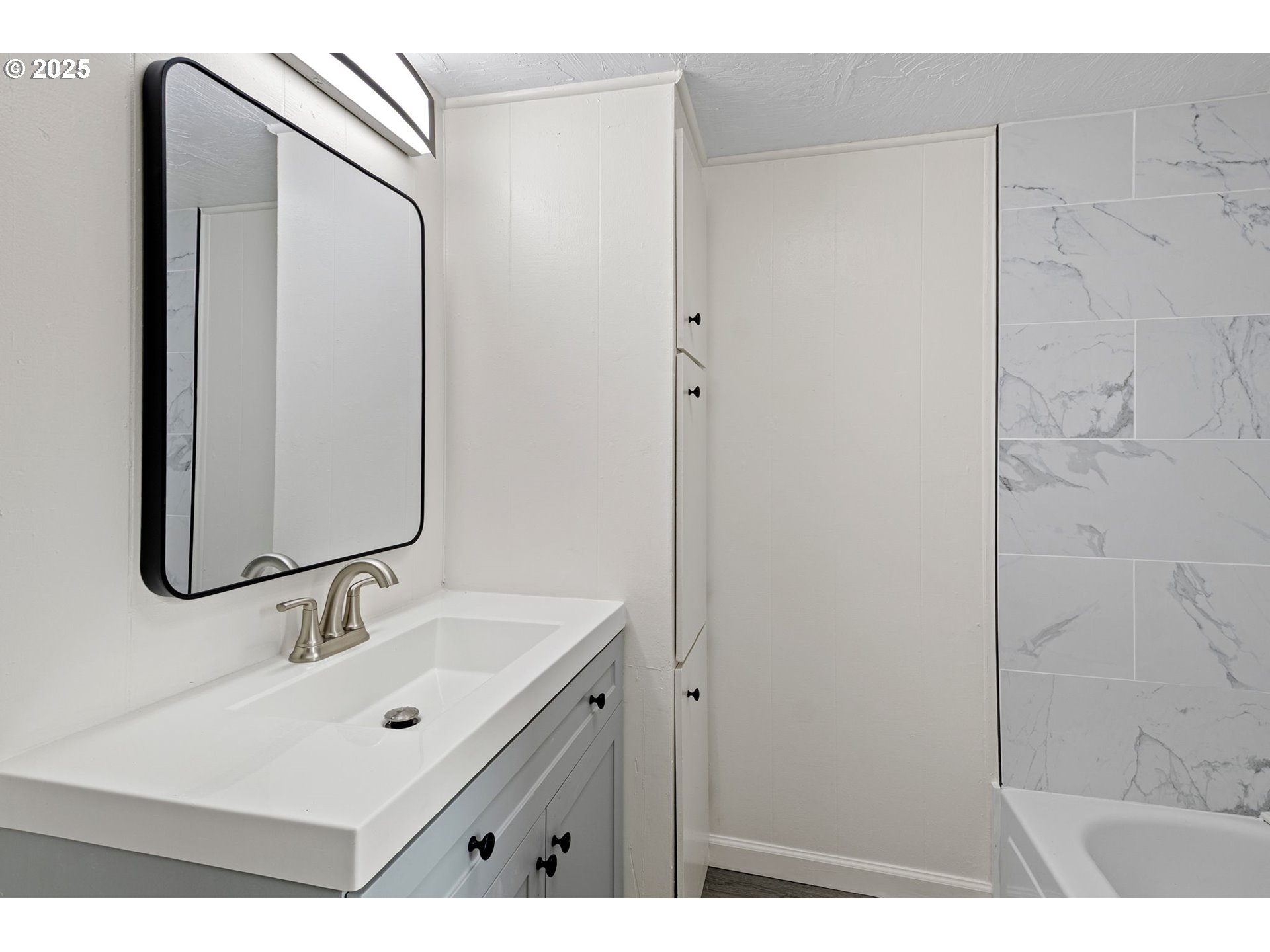 250 Northeast Jorgen Street Winston, OR 97496 - Photo 23 of 36 a bathroom with a sink and a mirror