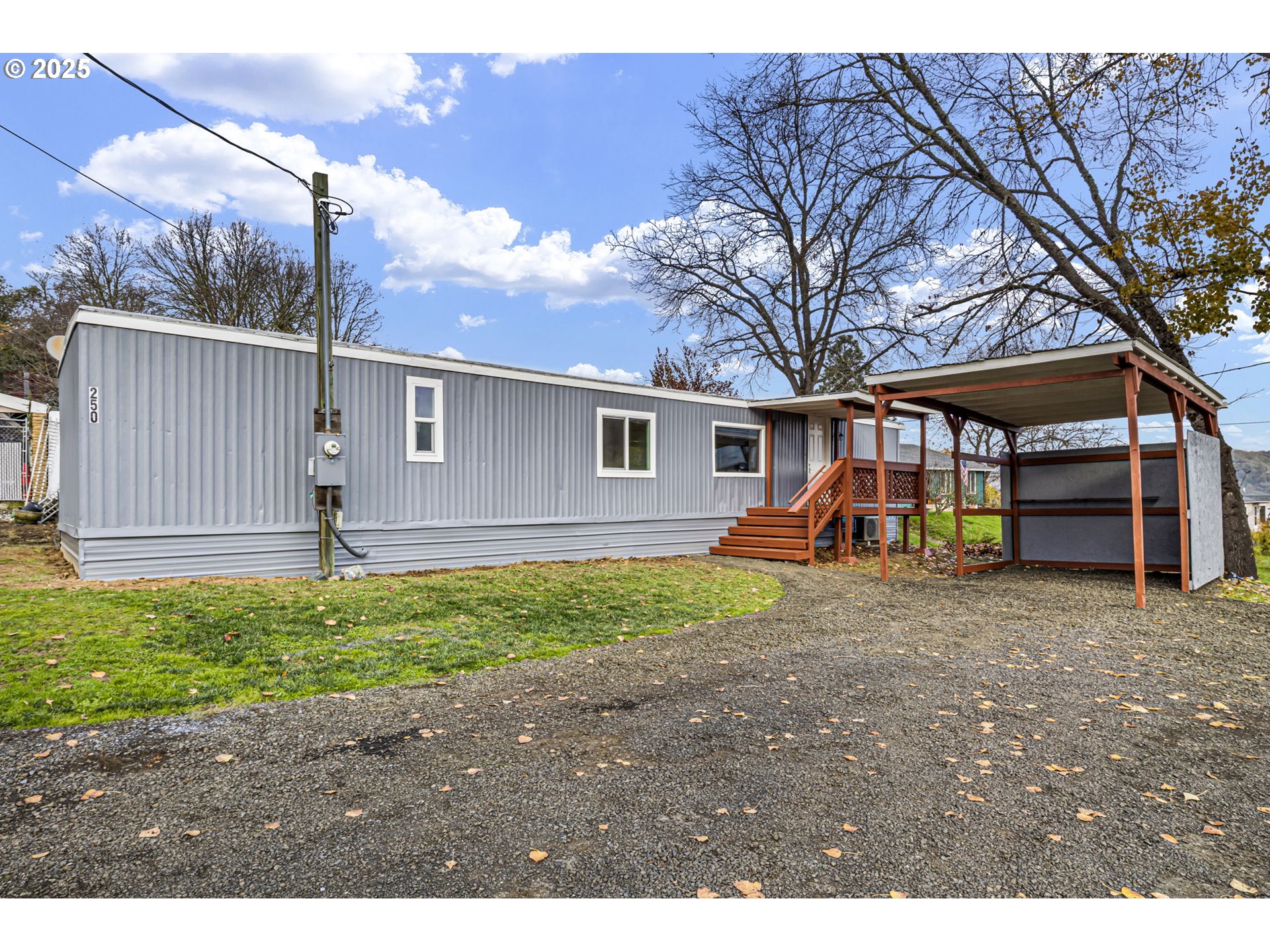 250 Northeast Jorgen Street Winston, OR 97496 - Photo 33 of 36 a view of a house with backyard and a tree