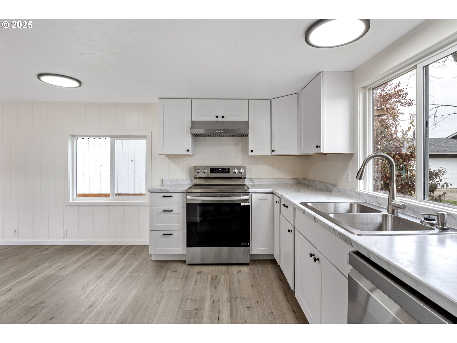 250 Northeast Jorgen Street Winston, OR 97496 - Photo 9 of 36 a kitchen with a sink cabinets and window