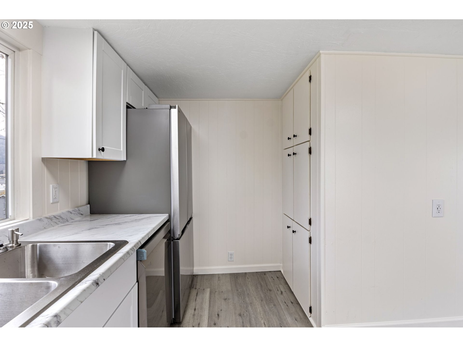 250 Northeast Jorgen Street Winston, OR 97496 - Photo 10 of 36 a kitchen with a refrigerator and a sink