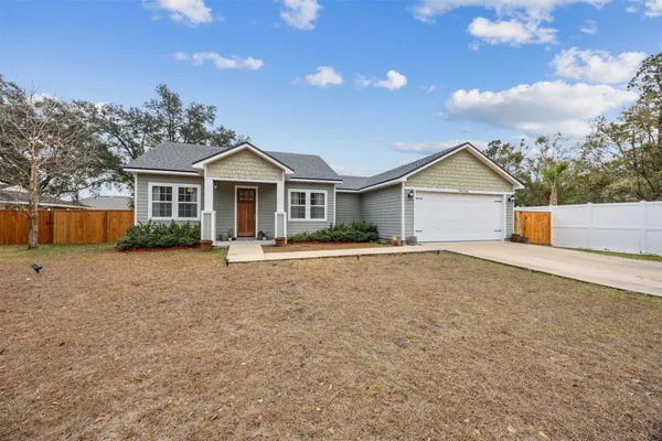 front view of a house with a yard