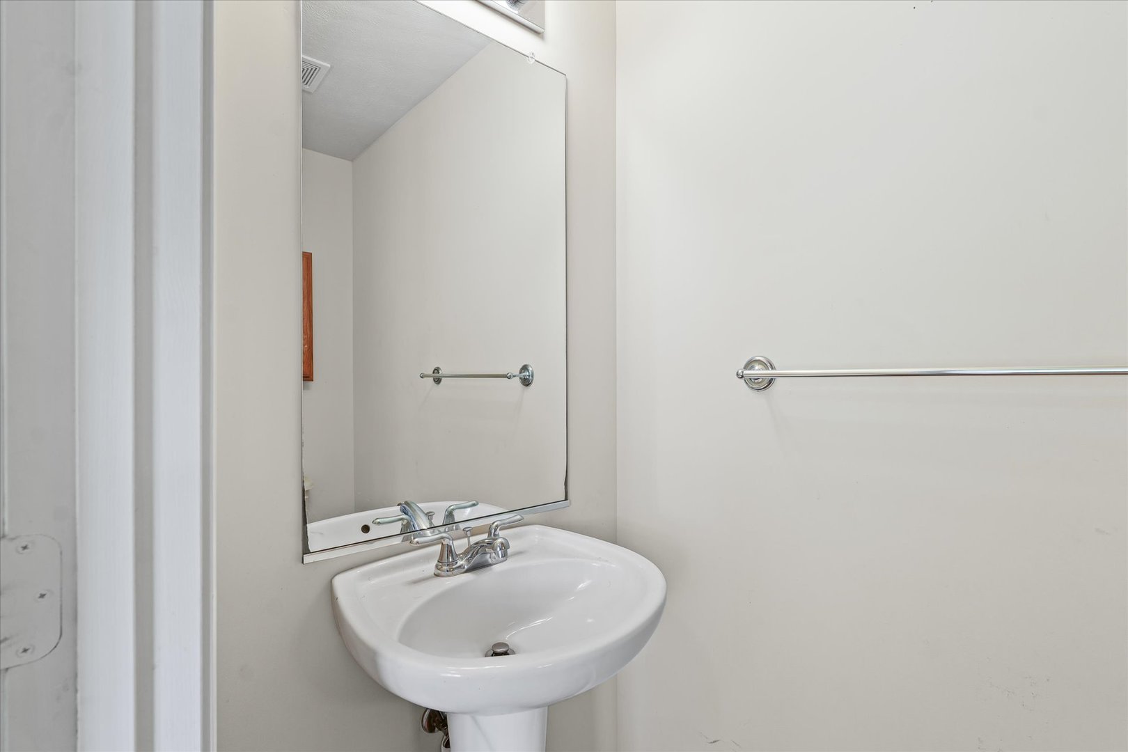 1418 Ogelthorpe Avenue Urbana, IL 61802 - Photo 16 of 36 a bathroom with a sink and mirror