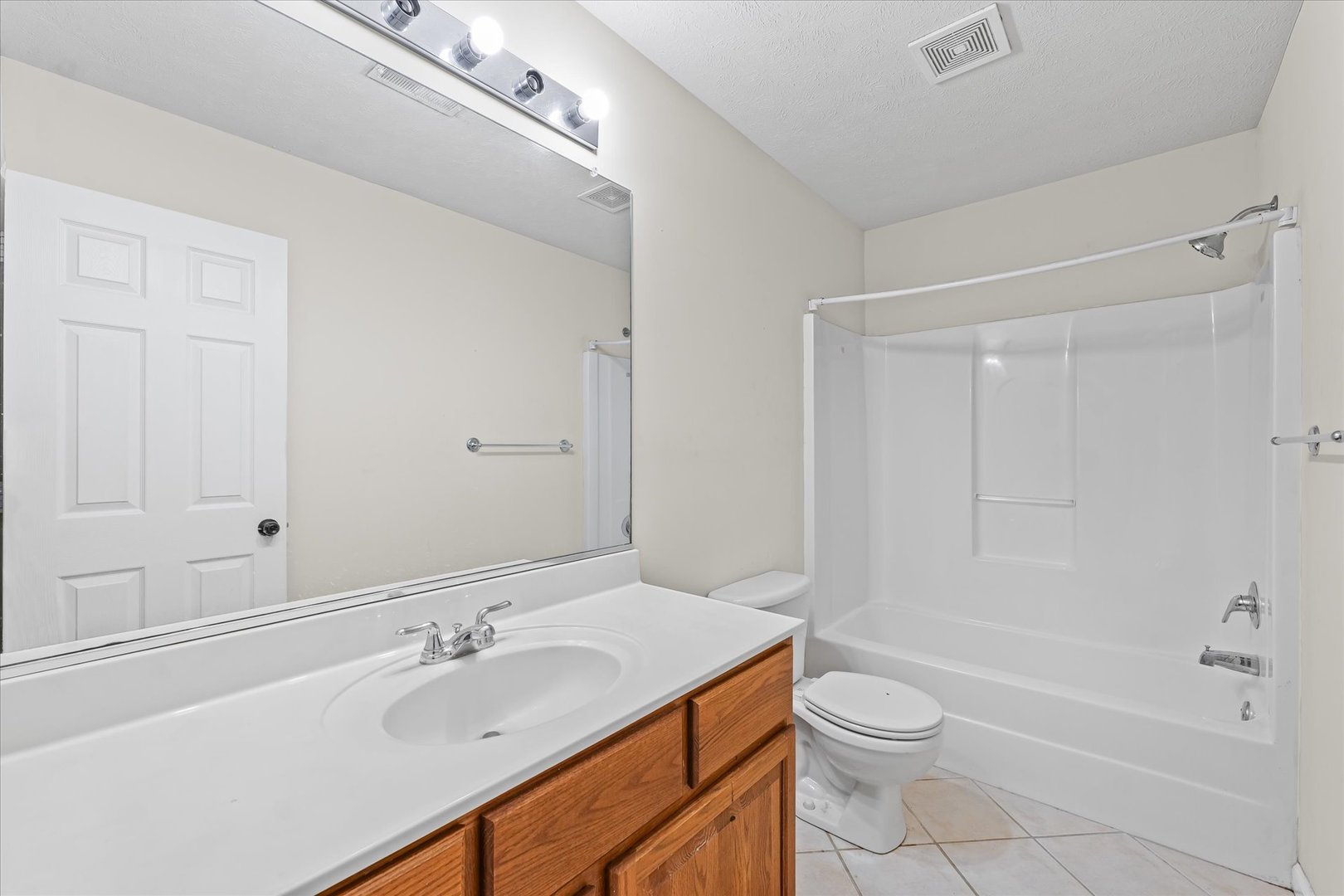 1418 Ogelthorpe Avenue Urbana, IL 61802 - Photo 19 of 36 a bathroom with a sink a toilet and shower