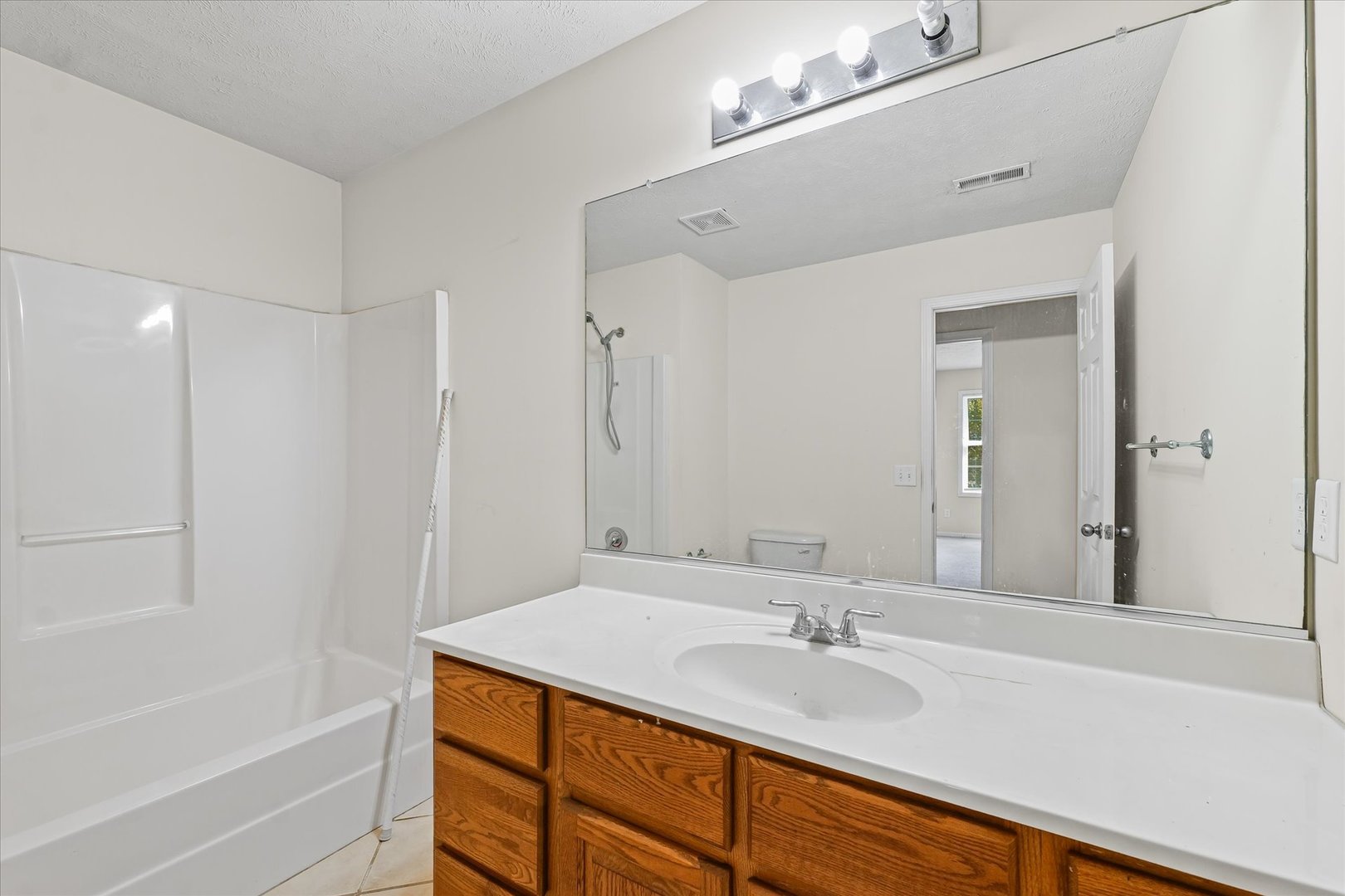 1418 Ogelthorpe Avenue Urbana, IL 61802 - Photo 24 of 36 a bathroom with a sink and a mirror