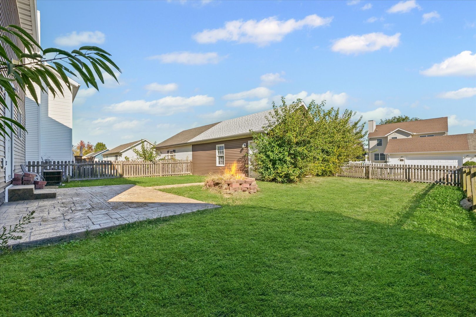 1418 Ogelthorpe Avenue Urbana, IL 61802 - Photo 31 of 36 a view of a house with a big yard and palm trees