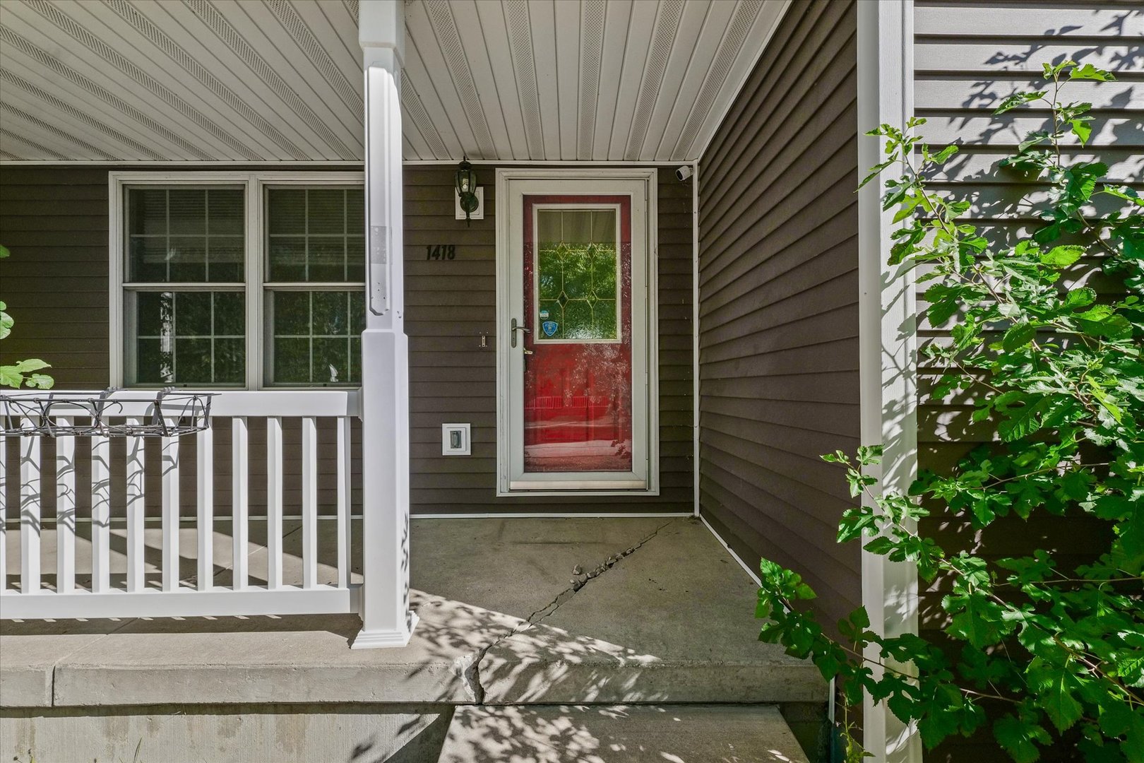 1418 Ogelthorpe Avenue Urbana, IL 61802 - Photo 4 of 36 a view of a house with a small yard and wooden floor and fence