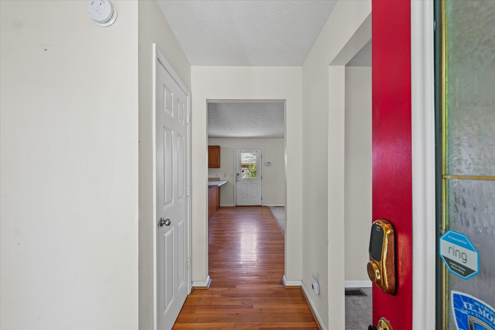 1418 Ogelthorpe Avenue Urbana, IL 61802 - Photo 5 of 36 a view of a hallway with wooden floor and closet