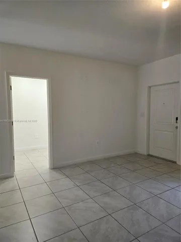 an empty room with a bathroom