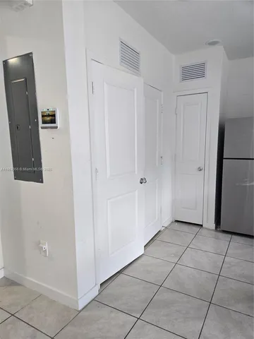 a view of a hallway with closet area