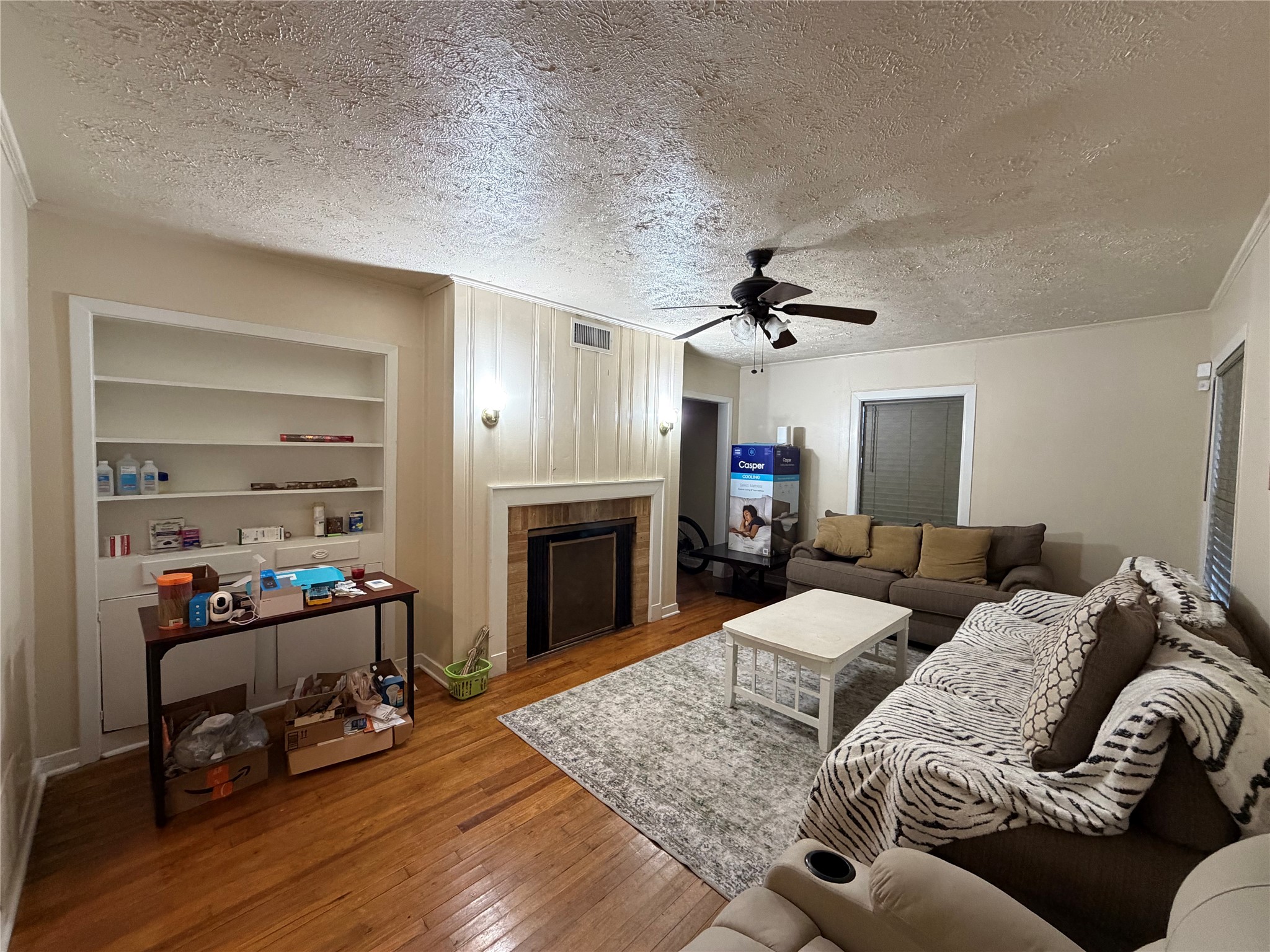 2406 Charleston Street Houston, TX 77021 - Photo 11 of 13 a living room with furniture and a fireplace