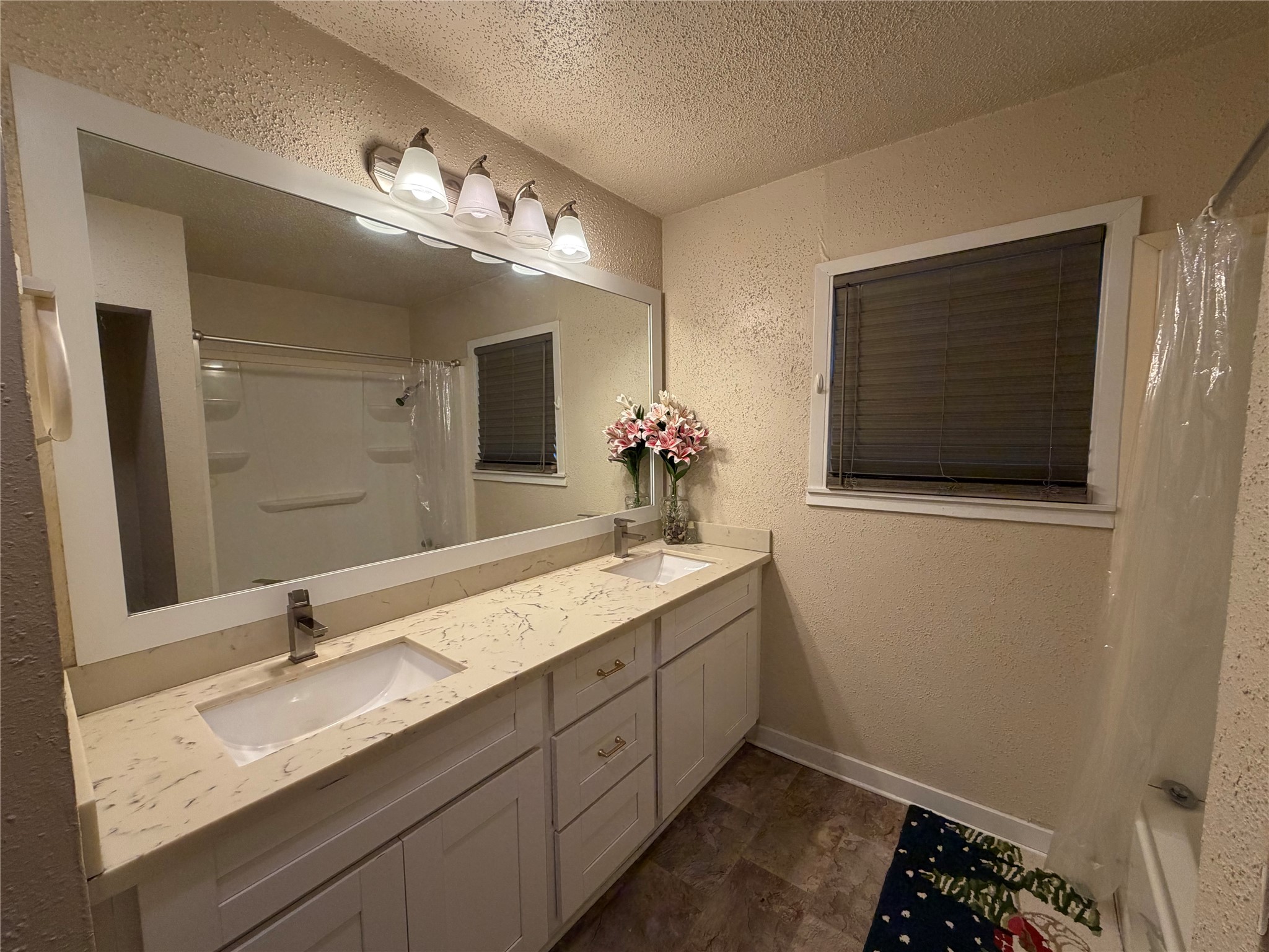 2406 Charleston Street Houston, TX 77021 - Photo 8 of 13 a bathroom with a double vanity sink and a mirror