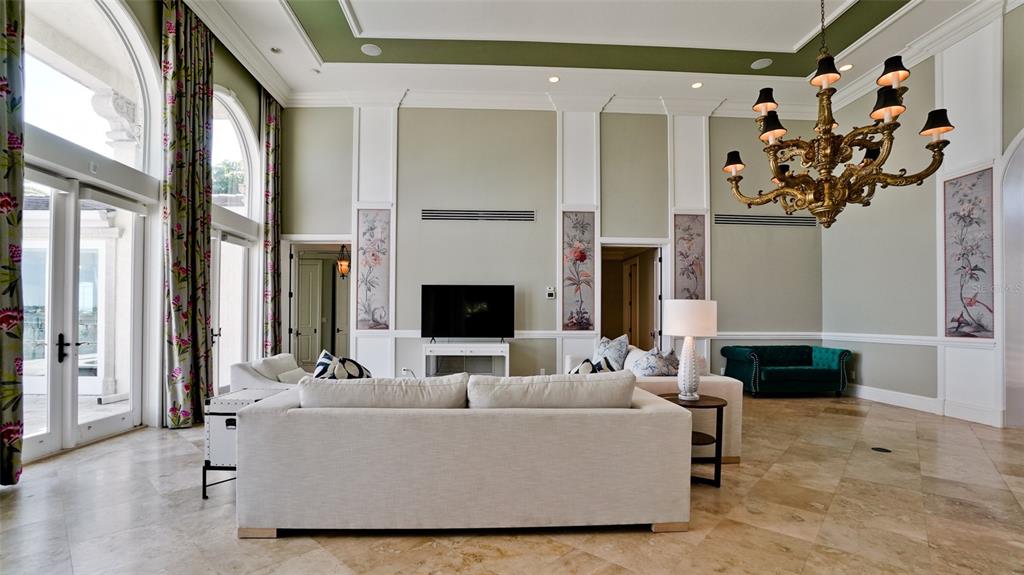 8213 Midnight Pass Road Sarasota, FL 34242 - Photo 12 of 52 a living room with furniture and a fireplace