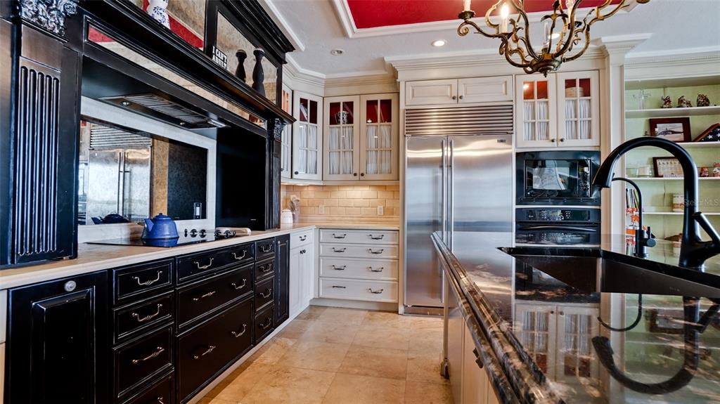 8213 Midnight Pass Road Sarasota, FL 34242 - Photo 15 of 52 a kitchen with cabinets and window