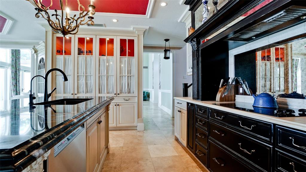 8213 Midnight Pass Road Sarasota, FL 34242 - Photo 16 of 52 a kitchen with a sink and cabinets