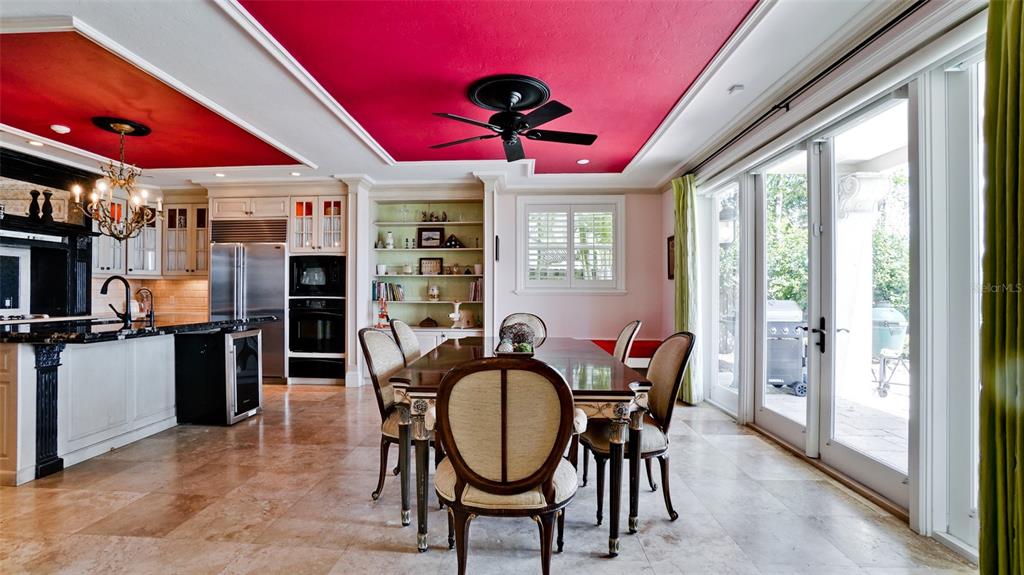 8213 Midnight Pass Road Sarasota, FL 34242 - Photo 18 of 52 a dining room with furniture and window