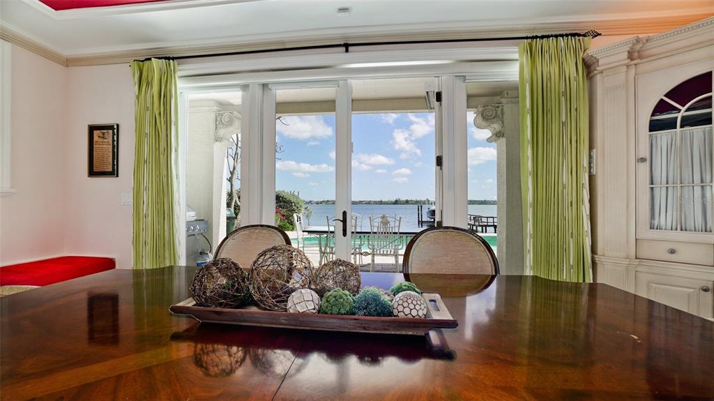 8213 Midnight Pass Road Sarasota, FL 34242 - Photo 19 of 52 a room with furniture and a wooden floor