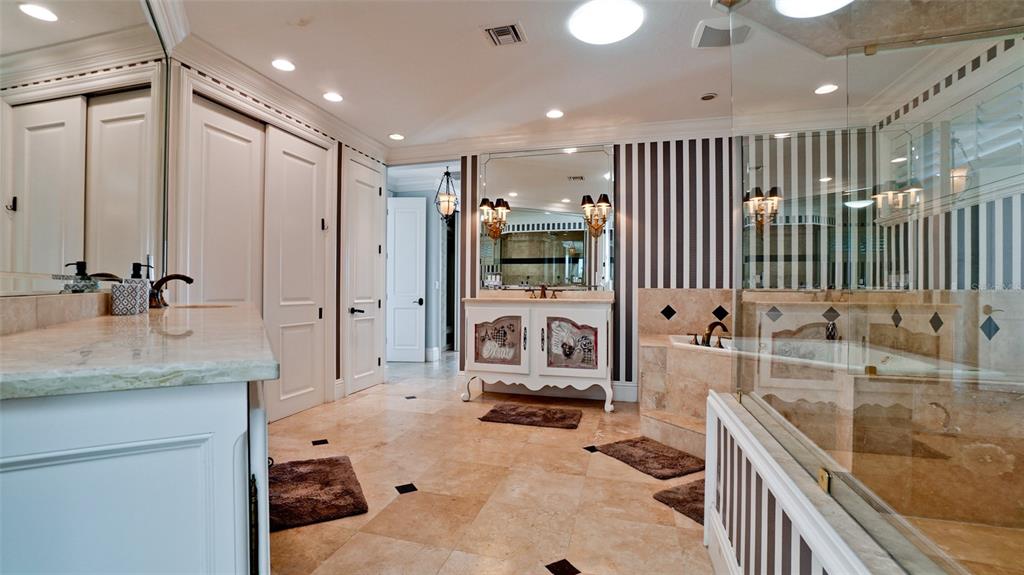 8213 Midnight Pass Road Sarasota, FL 34242 - Photo 23 of 52 a bathroom with a granite countertop sink mirror and tub