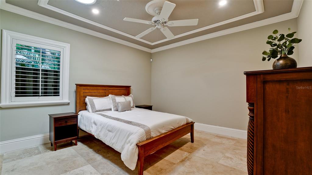 8213 Midnight Pass Road Sarasota, FL 34242 - Photo 30 of 52 a bedroom with a bed and a window