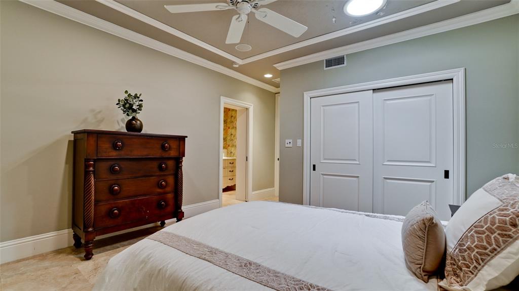 8213 Midnight Pass Road Sarasota, FL 34242 - Photo 31 of 52 a bedroom with a bed and a dresser