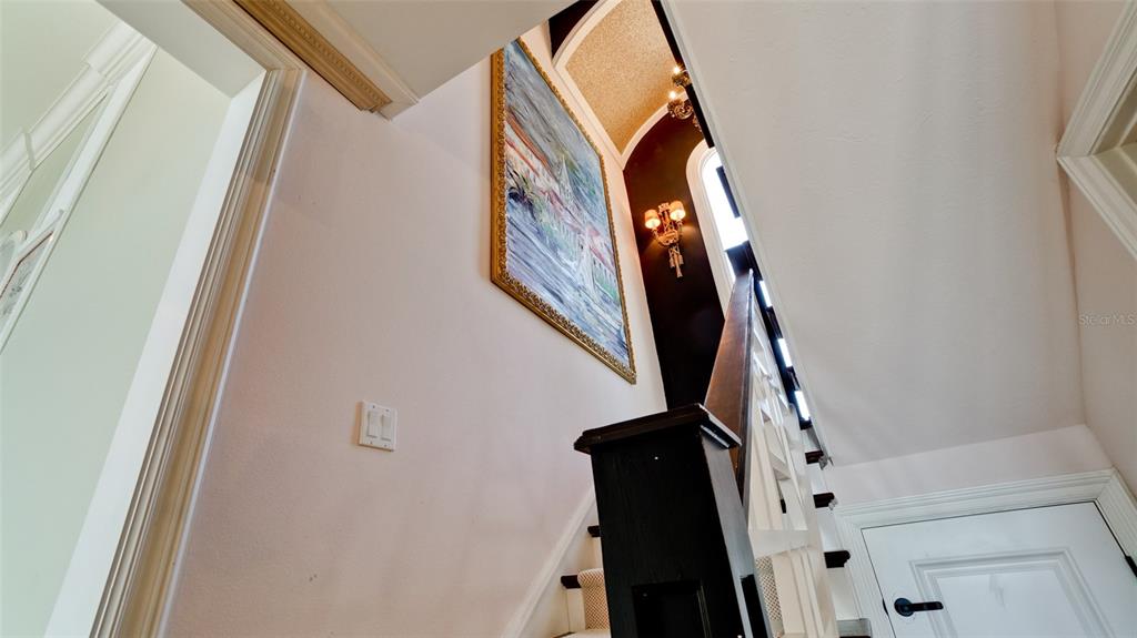 8213 Midnight Pass Road Sarasota, FL 34242 - Photo 33 of 52 a view of staircase with white walls and white door