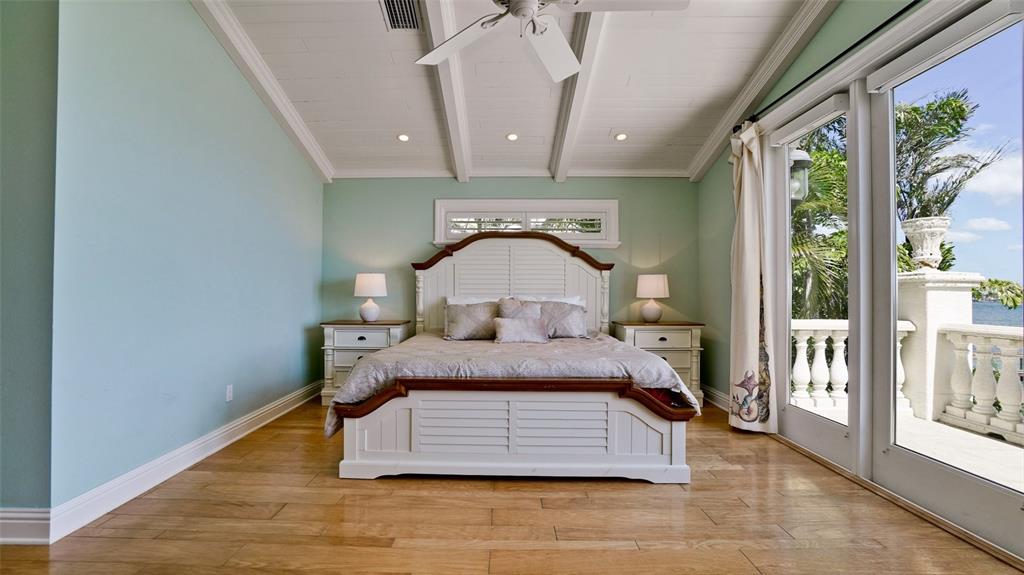 8213 Midnight Pass Road Sarasota, FL 34242 - Photo 38 of 52 a bed in a room next to a window