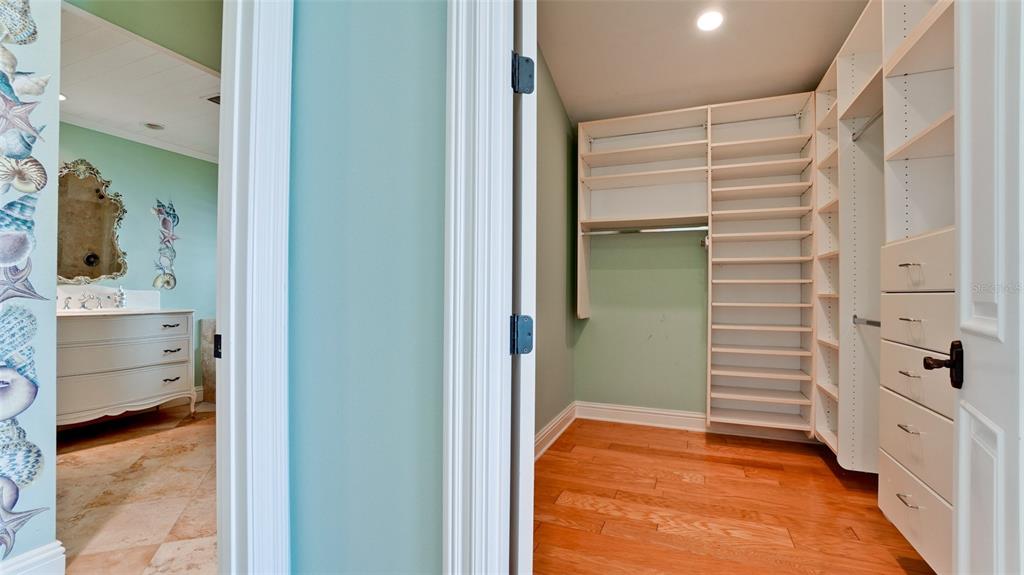 8213 Midnight Pass Road Sarasota, FL 34242 - Photo 39 of 52 a view of walk in closet and bedroom