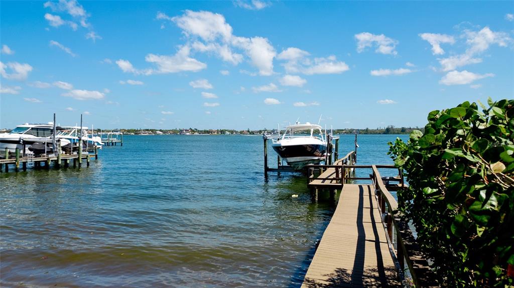 8213 Midnight Pass Road Sarasota, FL 34242 - Photo 47 of 52 a view of a lake with a sitting area