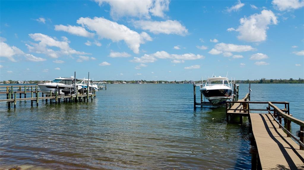 8213 Midnight Pass Road Sarasota, FL 34242 - Photo 49 of 52 a view of a lake with boats and wooden floor